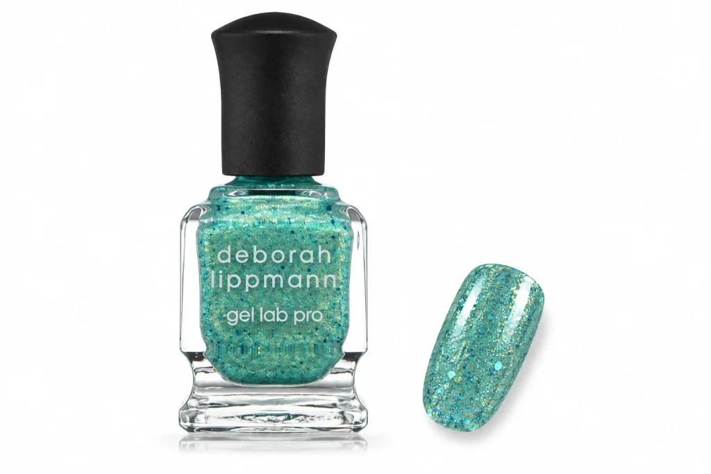 Deborah Lippmann Mermaid's Dream turquoise glitter nail polish bottle with one nail painted in the glitter, one of the best glitter nail polish picks