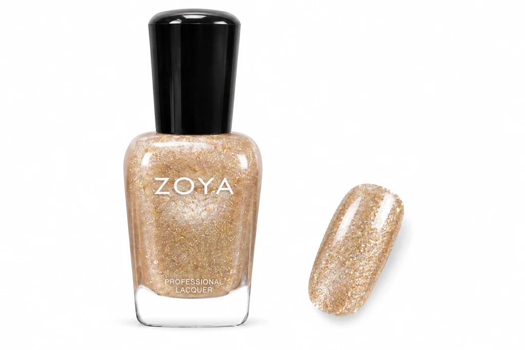 Zoya Nahla champagne gold glitter nail polish bottle with one nail painted in the glitter, one of the best glitter nail polish picks